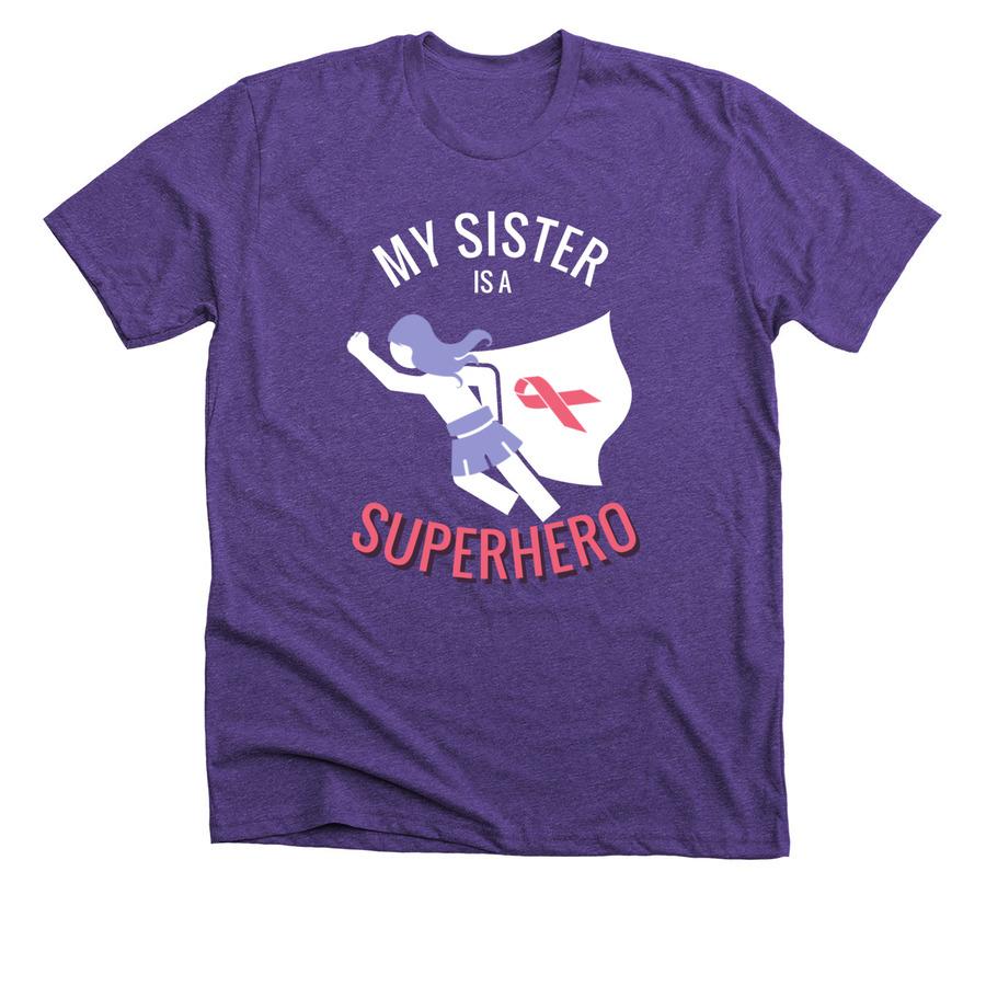 A purple shirt with white and pink font and a pink cancer ribbon graphic on the cape of a superhero girl.