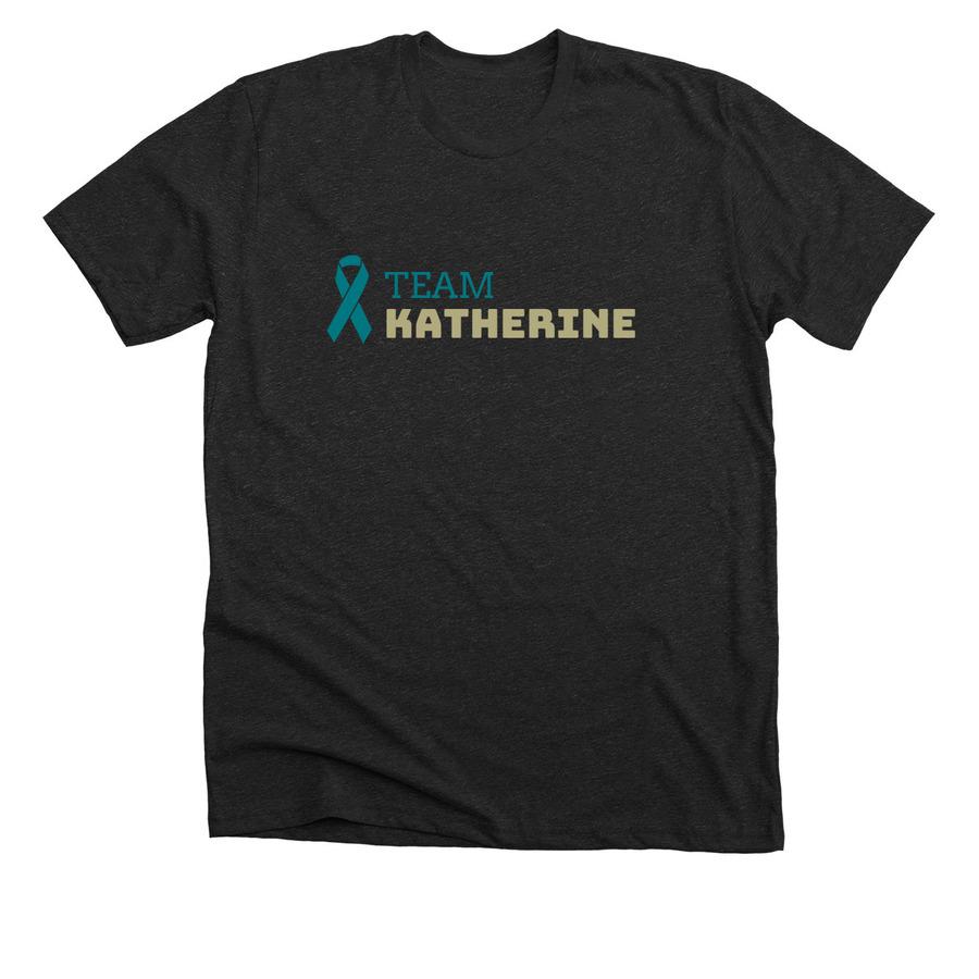 A charcoal black shirt with gold and green font and a green cancer ribbon graphic.