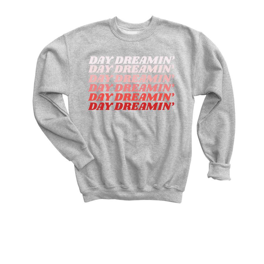 A grey typography crewneck sweatshirt that says, "Day dreamin'".