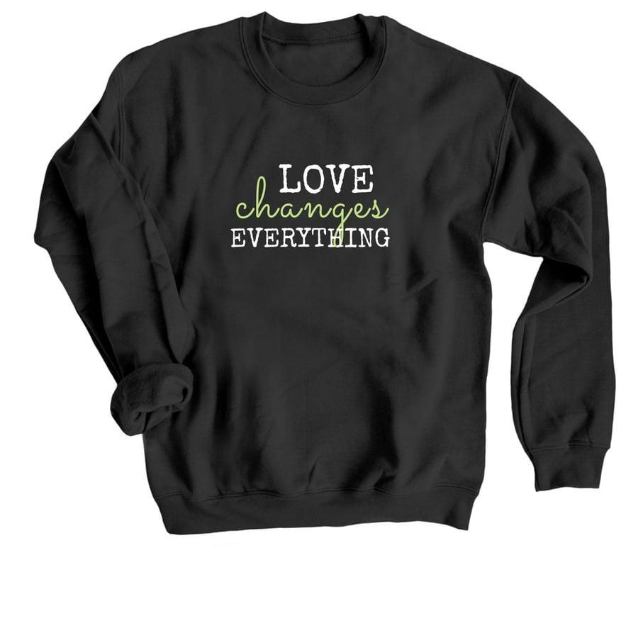 A black adoption shirt that says "Love Changes Everything".