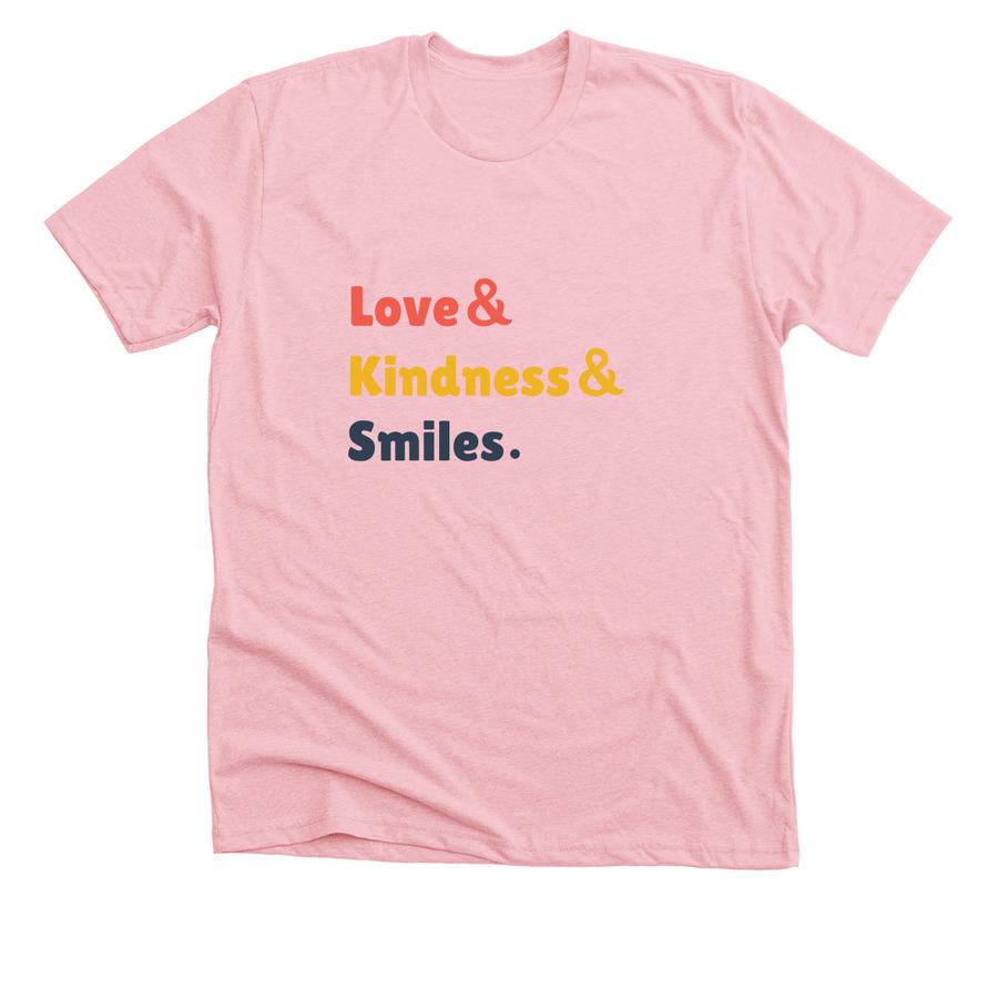 A light pink inspirational shirt that says, "Love and kindness and smiles".