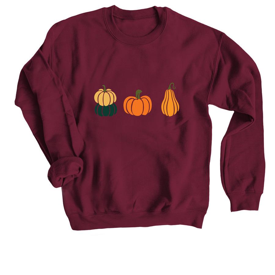 A fall t-shirt design that has three graphics of pumpkins.