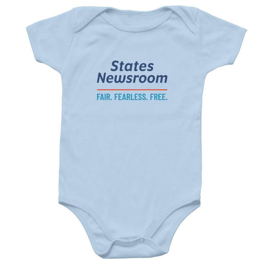 A wee bit of news, a Light Blue Infant Onesie
