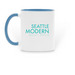 "In with the Rain" Logo Mug, a Light Blue Two-Tone Ceramic Mug (back-view)