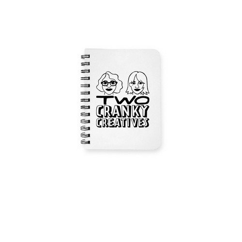Two Cranky Creatives Logo, a White Spiral Notebook