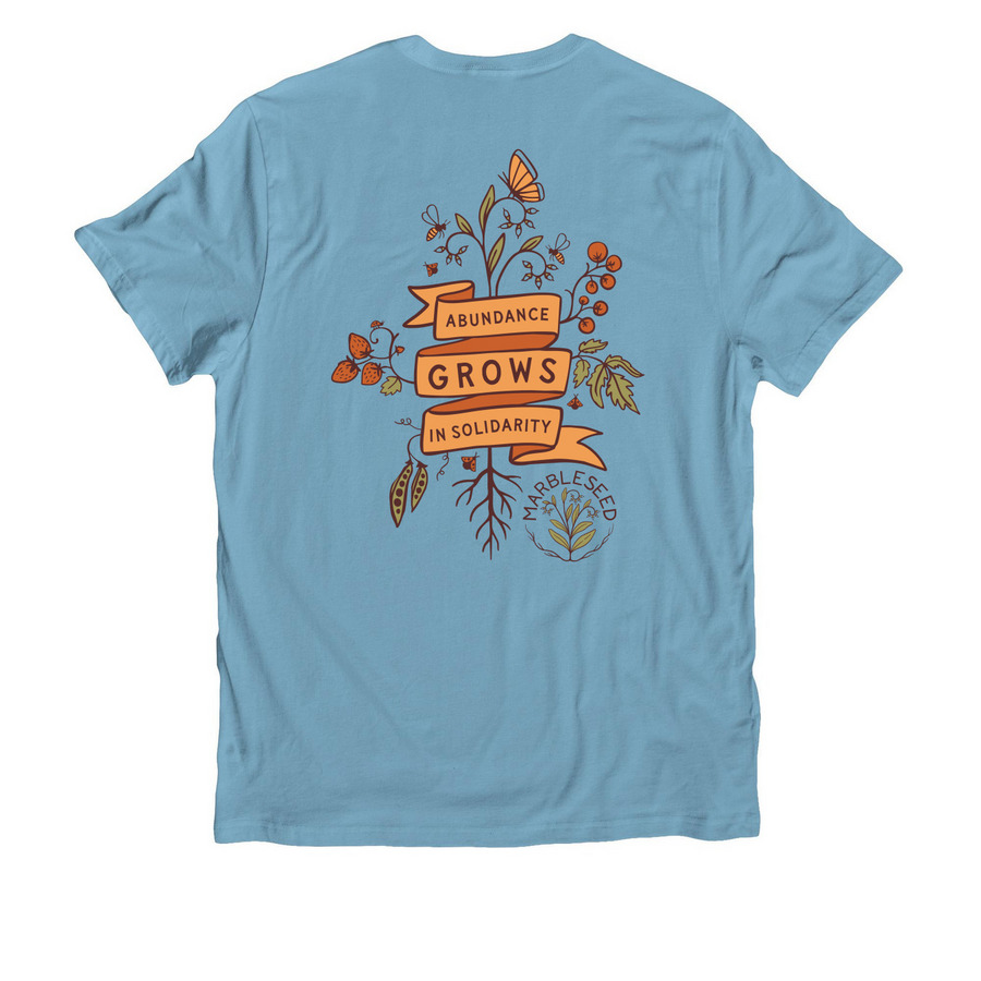 Abundance Grows in Solidarity, a Arctic Blue Allmade Organic Cotton Unisex Tee (back-view)