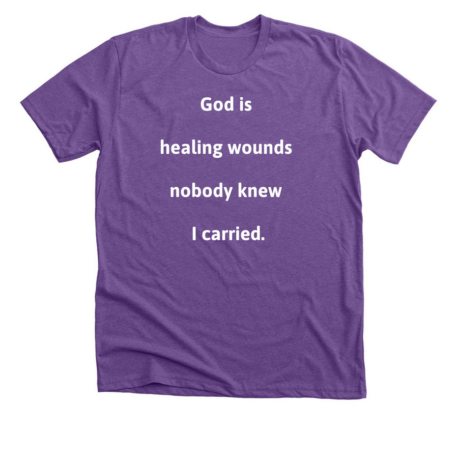 God is healing wounds nobody knew I carried, a Heather Team Purple Premium Unisex Tee