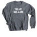 Callisto Shirt - You Are Not Alone, a Dark Heather Crewneck Sweatshirt